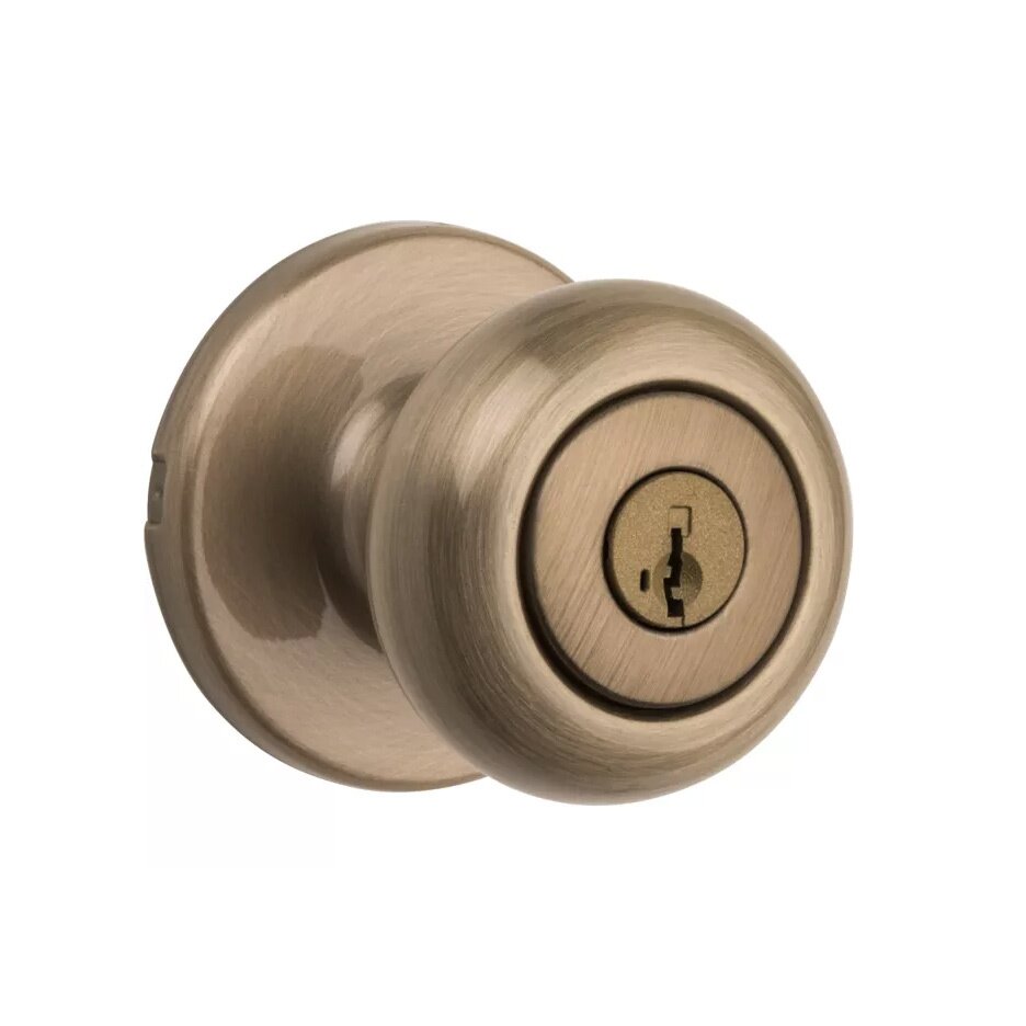 Cove Keyed Entry Door Knob in Antique Brass