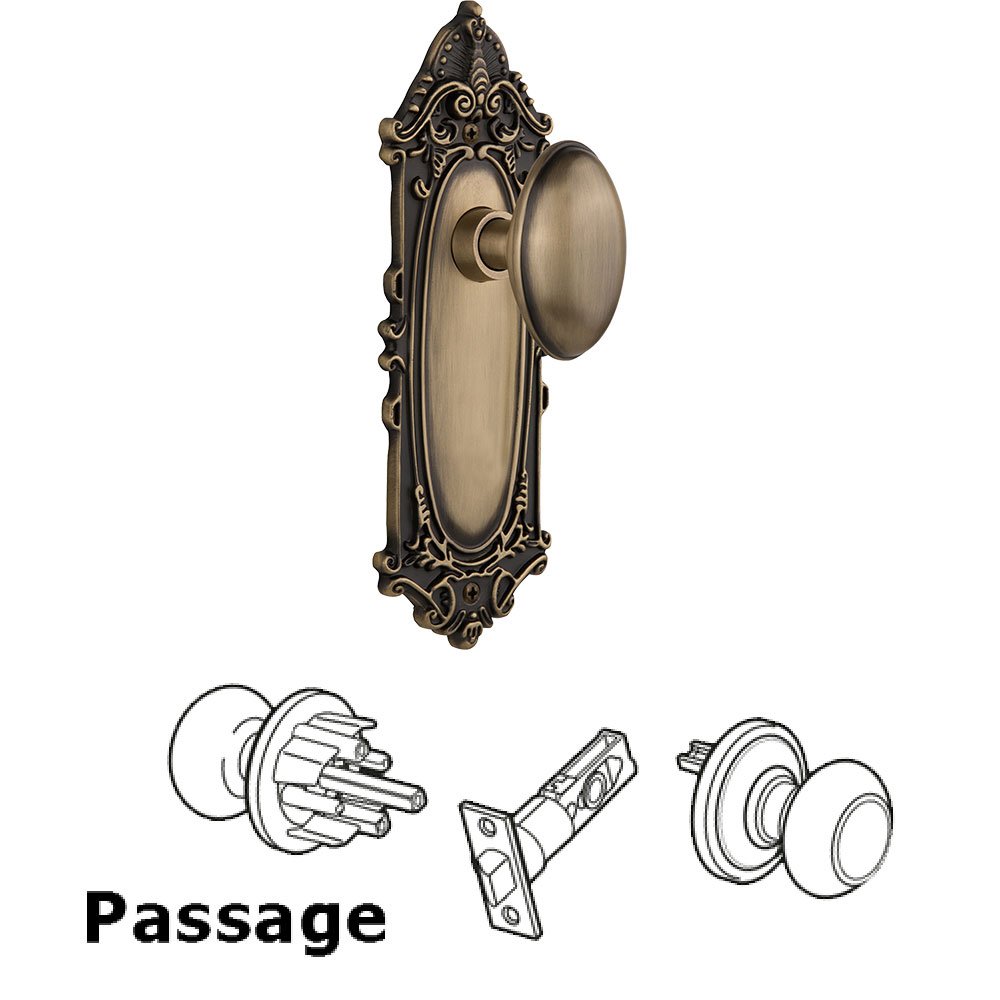 Passage Victorian Plate with Homestead Door Knob in Antique Brass