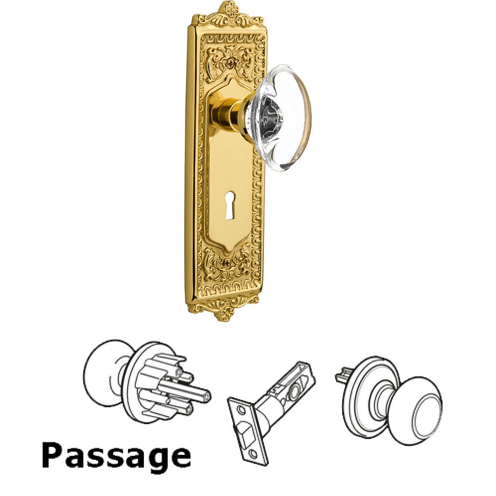 Passage Egg & Dart Plate with Keyhole and Oval Clear Crystal Glass Door Knob in Polished Brass
