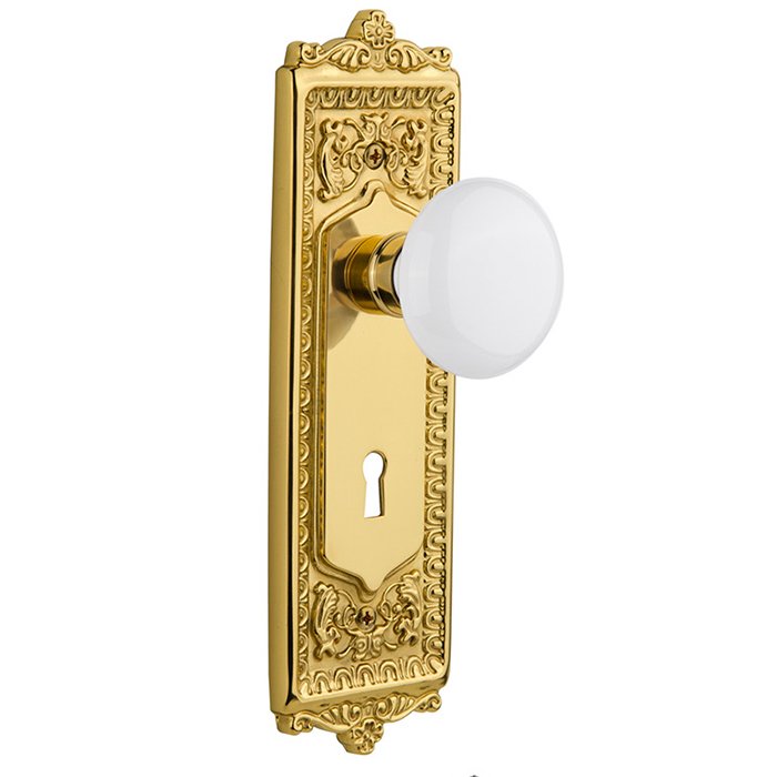 Interior Mortise Egg & Dart Plate White Porcelain Door Knob in Polished Brass