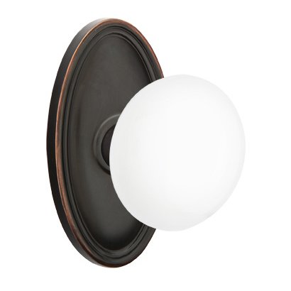 Passage Ice White Porcelain Knob With Oval Rosette in Oil Rubbed Bronze