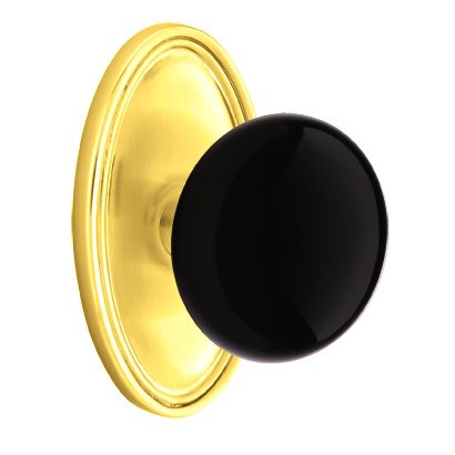 Privacy Ebony Knob And Oval Rosette With Concealed Screws in Polished Brass