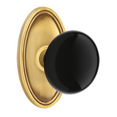 Single Dummy Ebony Porcelain Knob With Oval Rosette in French Antique Brass