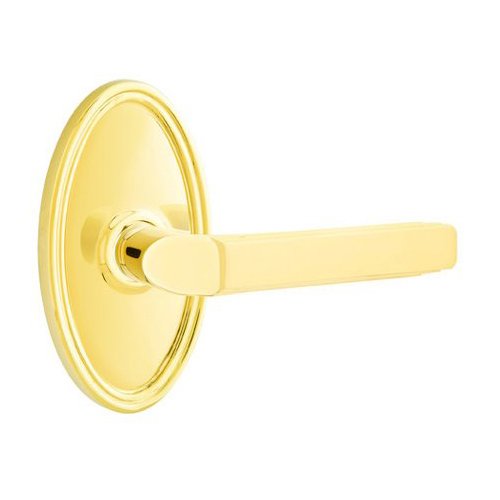 Single Dummy Right Handed Milano Door Lever With Oval Rose in Unlacquered Brass