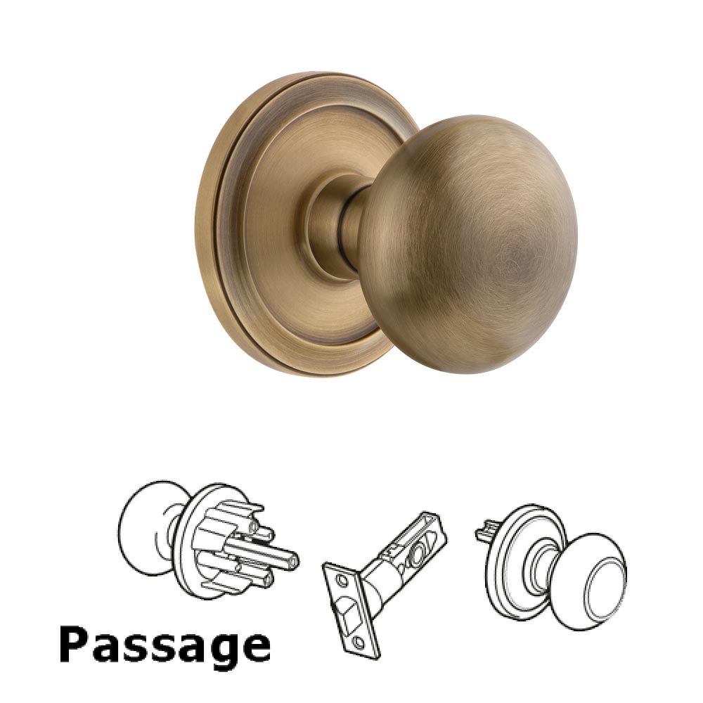 Grandeur Circulaire Rosette Passage with Fifth Avenue Knob in Vintage Brass