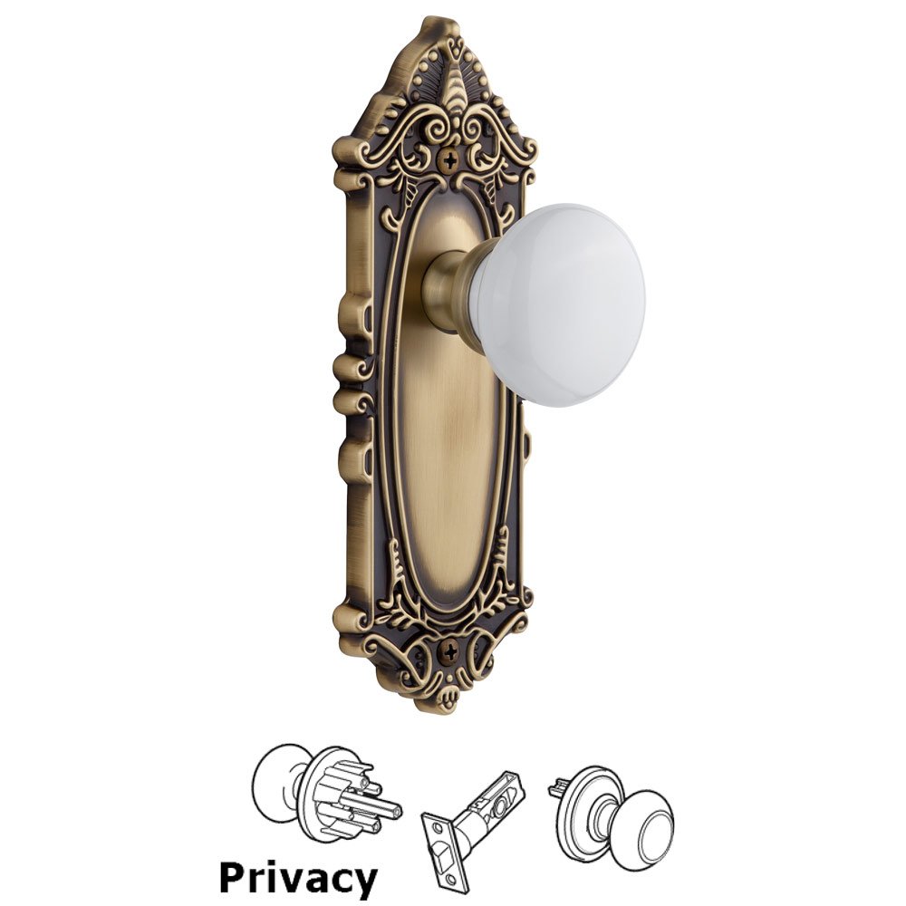 Grande Victorian Plate Privacy with Hyde Park White Porcelain Knob in Vintage Brass