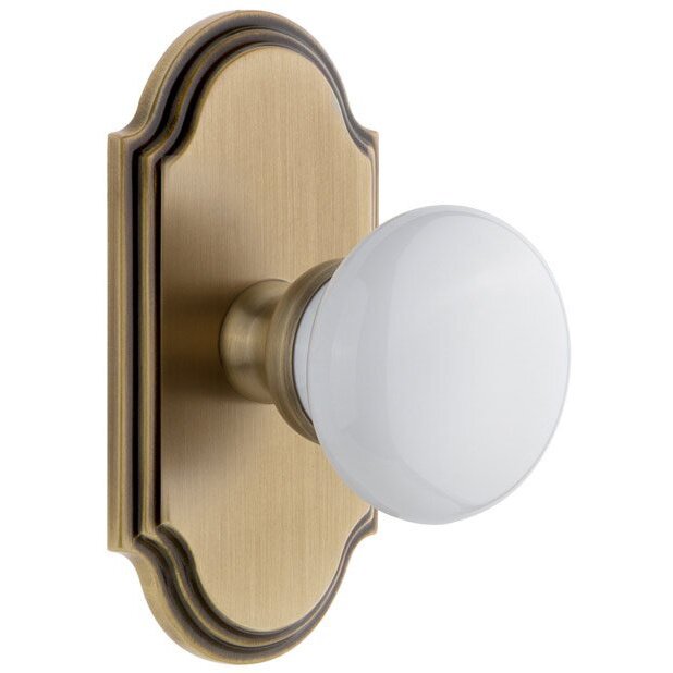 Arc Plate Privacy with Hyde Park White Porcelain Knob in Vintage Brass