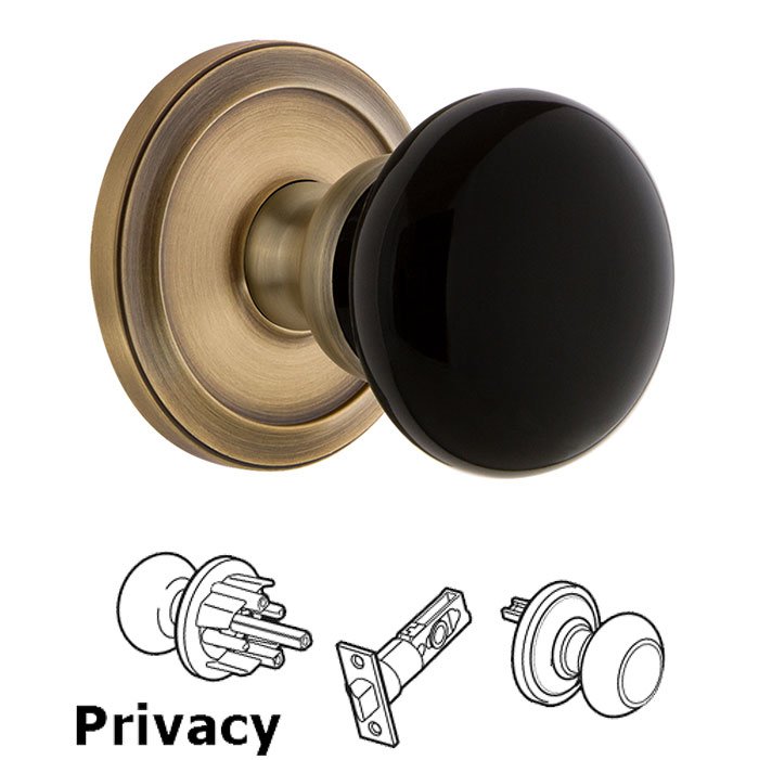 Privacy - Circulaire Rosette with Black Coventry Porcelain Knob in Vintage Brass