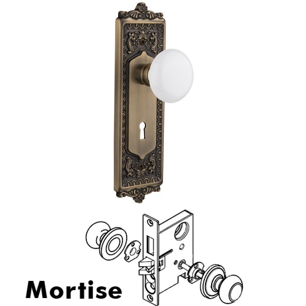 Complete Mortise Lockset - Egg & Dart Plate with White Porcelain Knob in Antique Brass