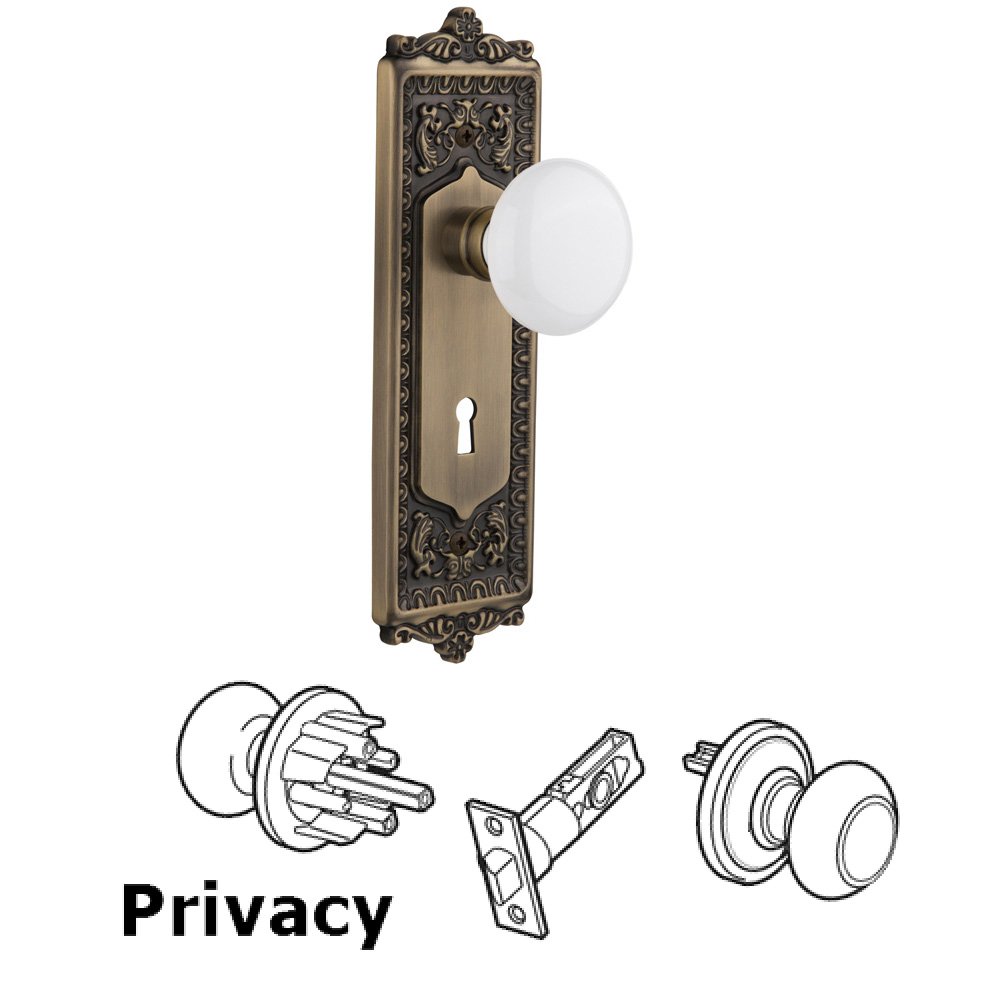 Complete Privacy Set With Keyhole - Egg & Dart Plate with White Porcelain Knob in Antique Brass