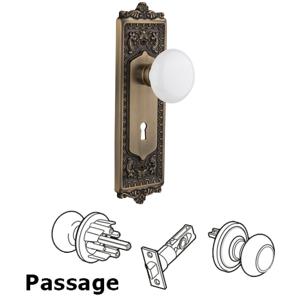 Complete Passage Set With Keyhole - Egg & Dart Plate with White Porcelain Knob in Antique Brass