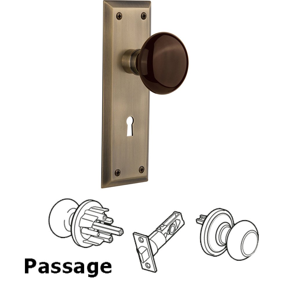 Passage New York Plate with Keyhole and Brown Porcelain Door Knob in Antique Brass