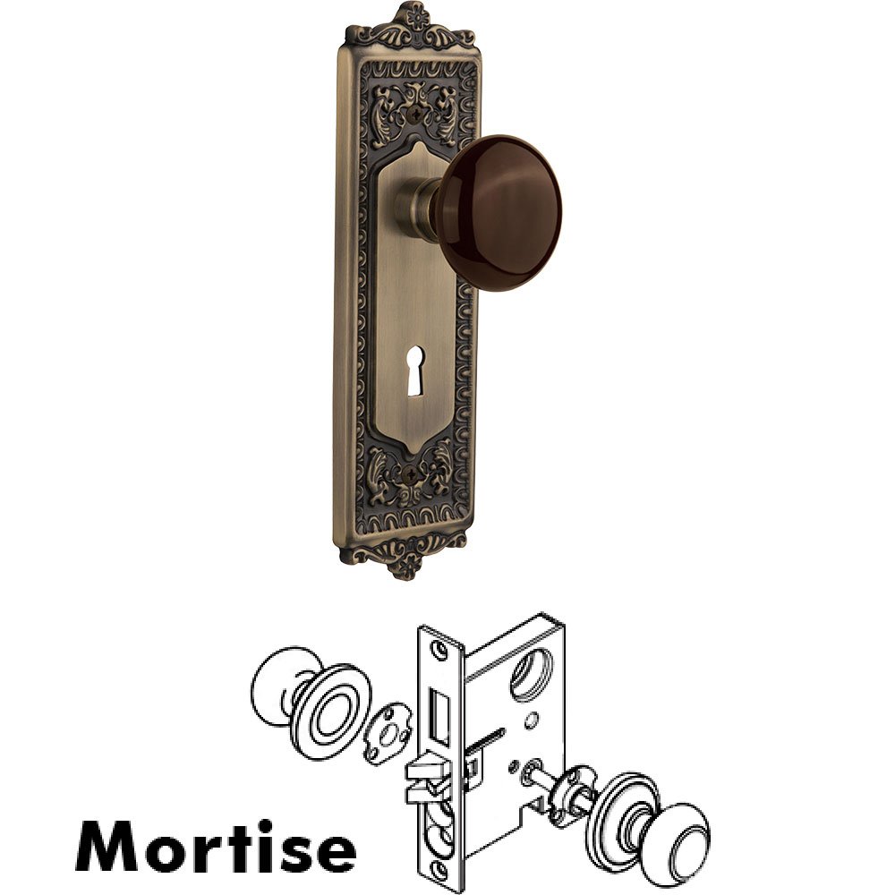 Mortise - Egg and Dart Plate with Brown Porcelain Knob with Keyhole in Antique Brass