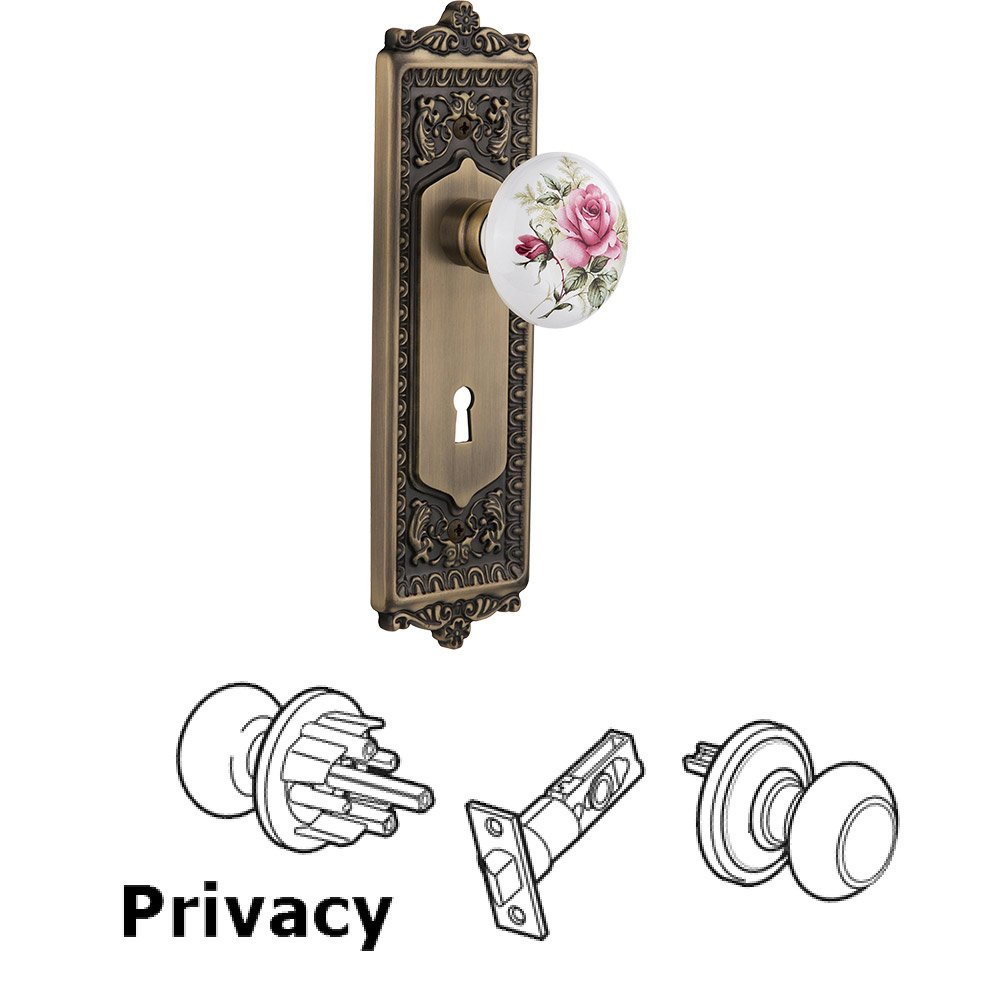 Privacy Egg & Dart Plate with Keyhole and White Rose Porcelain Door Knob in Antique Brass