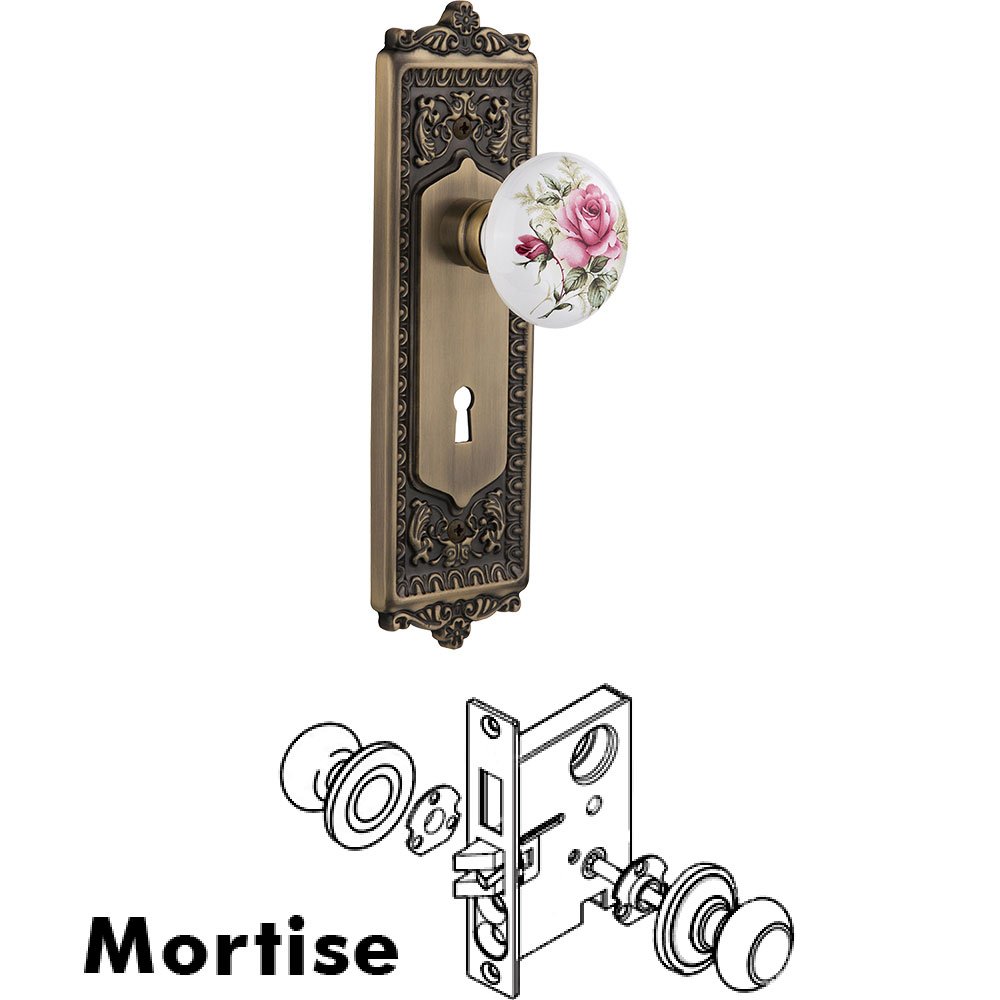 Mortise - Egg and Dart Plate with Rose Porcelain Knob with Keyhole in Antique Brass