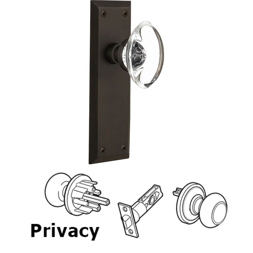 Privacy New York Plate with Oval Clear Crystal Glass Door Knob in Oil-Rubbed Bronze