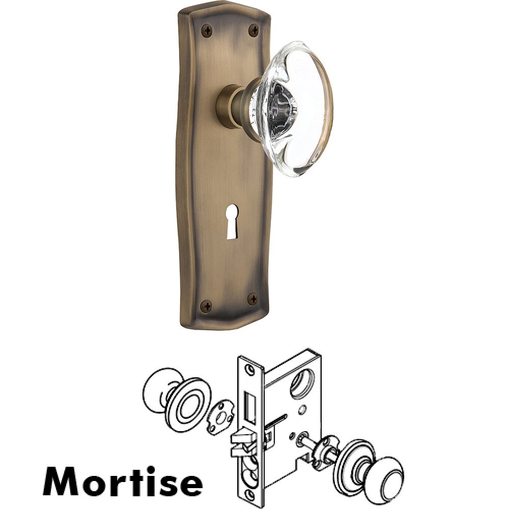 Mortise - Prairie Plate with Oval Clear Crystal Knob with Keyhole in Antique Brass