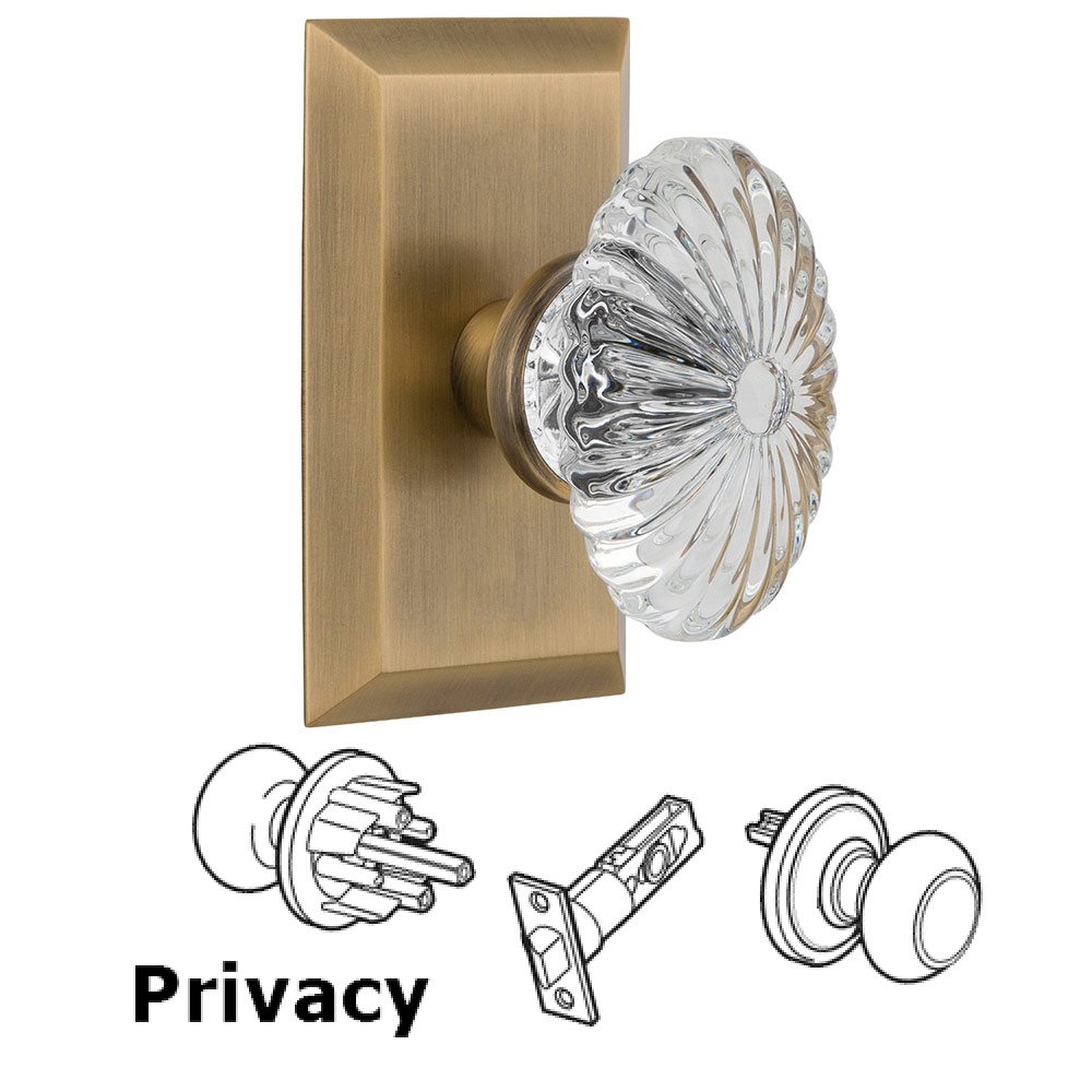 Privacy Studio Plate with Oval Fluted Crystal Knob in Antique Brass