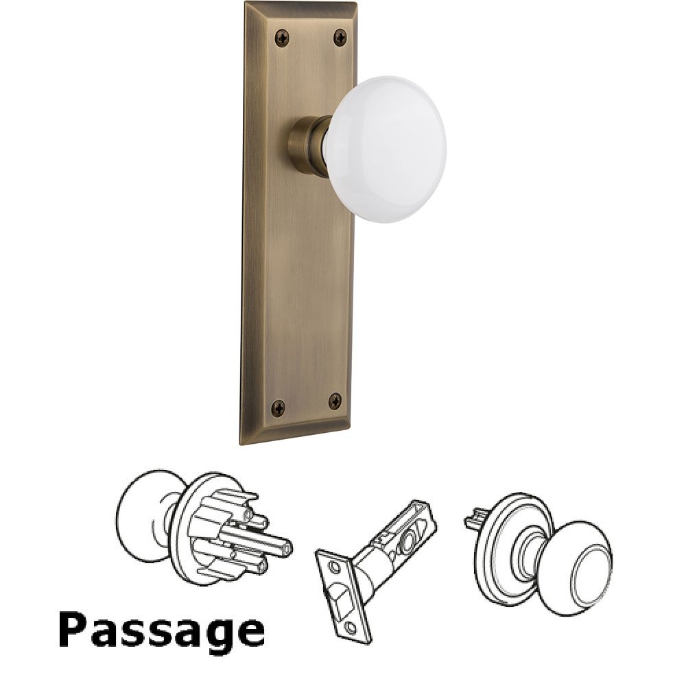 Passage New York Plate with White Porcelain Door Knob in Antique Brass