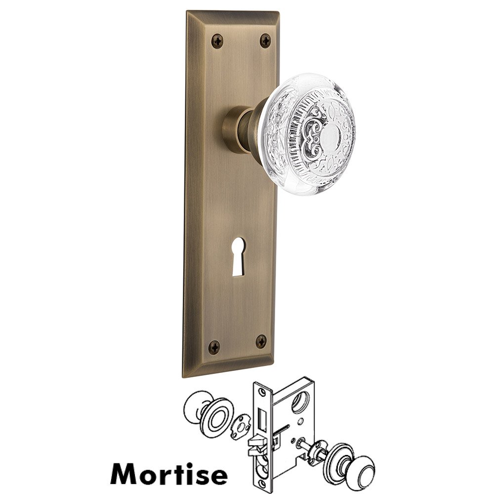 Mortise - New York Plate With Crystal Egg & Dart Knob in Antique Brass