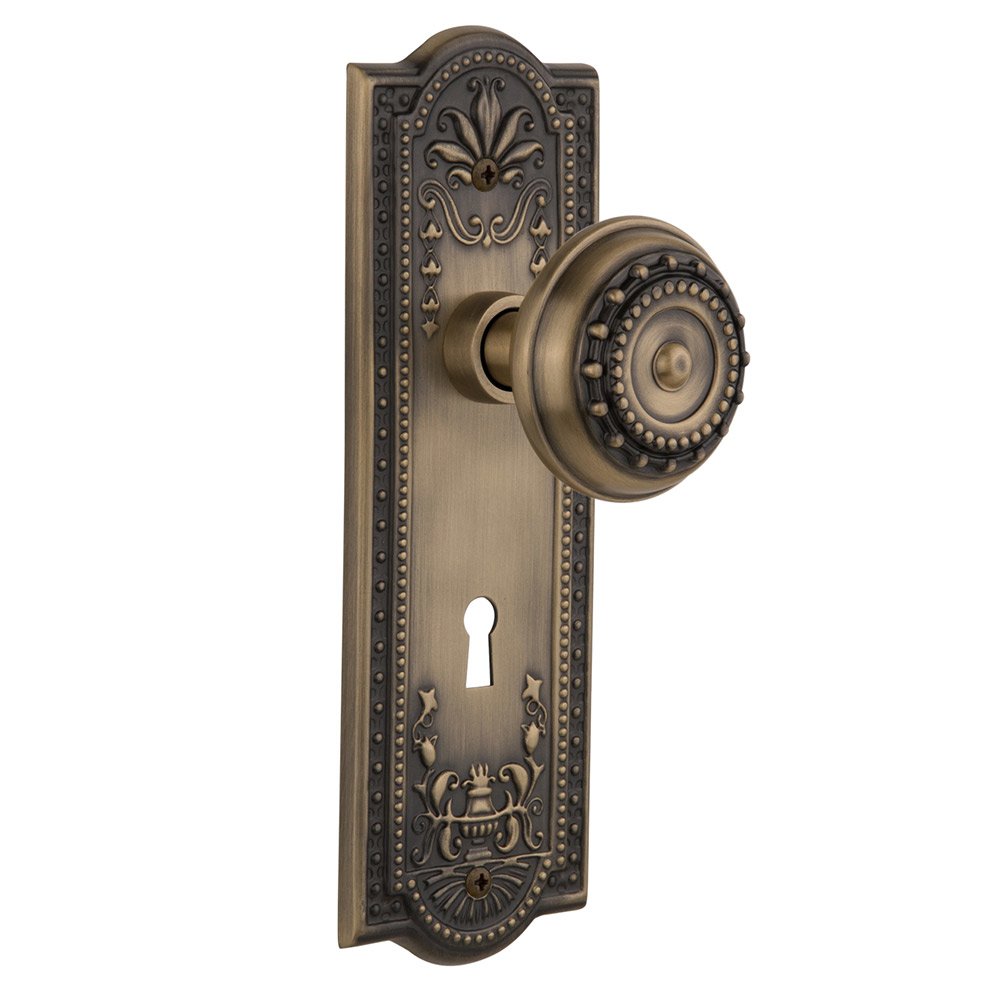 Passage Meadows Plate with Keyhole and Meadows Door Knob in Antique Brass