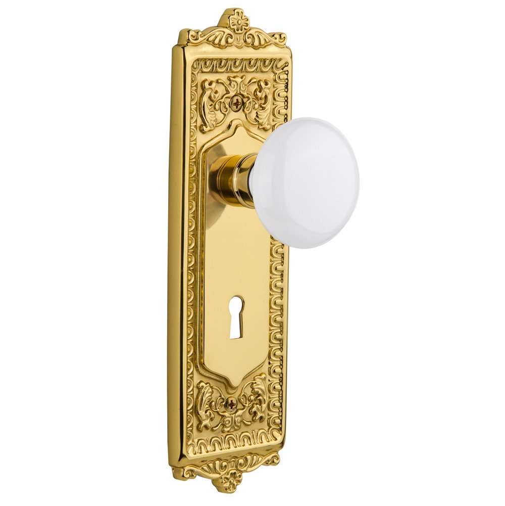 Double Dummy Egg & Dart Plate with Keyhole and White Porcelain Door Knob in Polished Brass