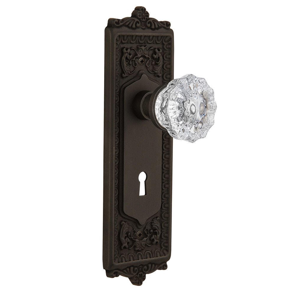 Passage Egg & Dart Plate with Keyhole and Crystal Glass Door Knob in Oil-Rubbed Bronze