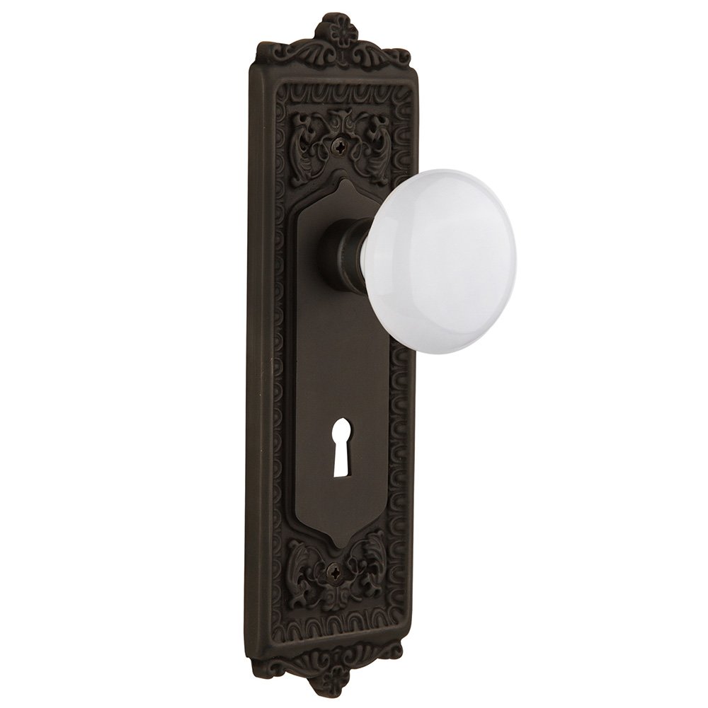 Privacy Egg & Dart Plate with Keyhole and White Porcelain Door Knob in Oil-Rubbed Bronze