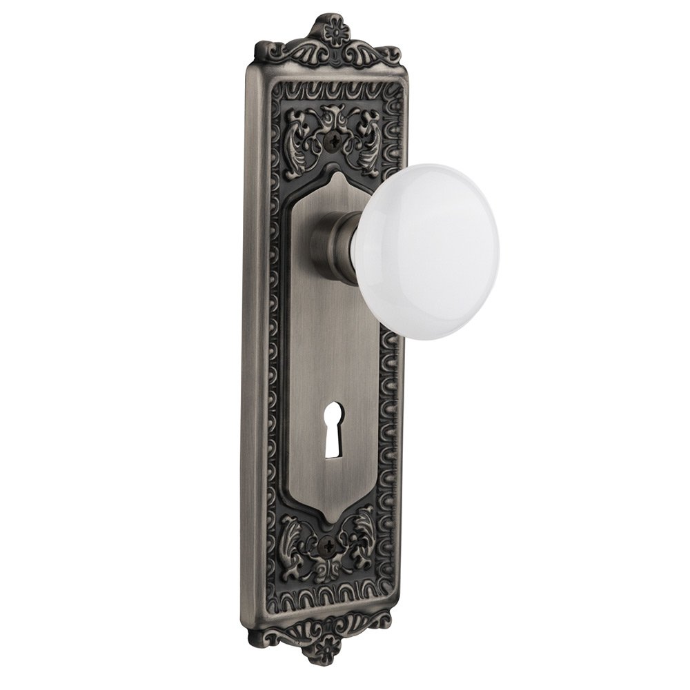 Passage Egg & Dart Plate with Keyhole and White Porcelain Door Knob in Antique Pewter