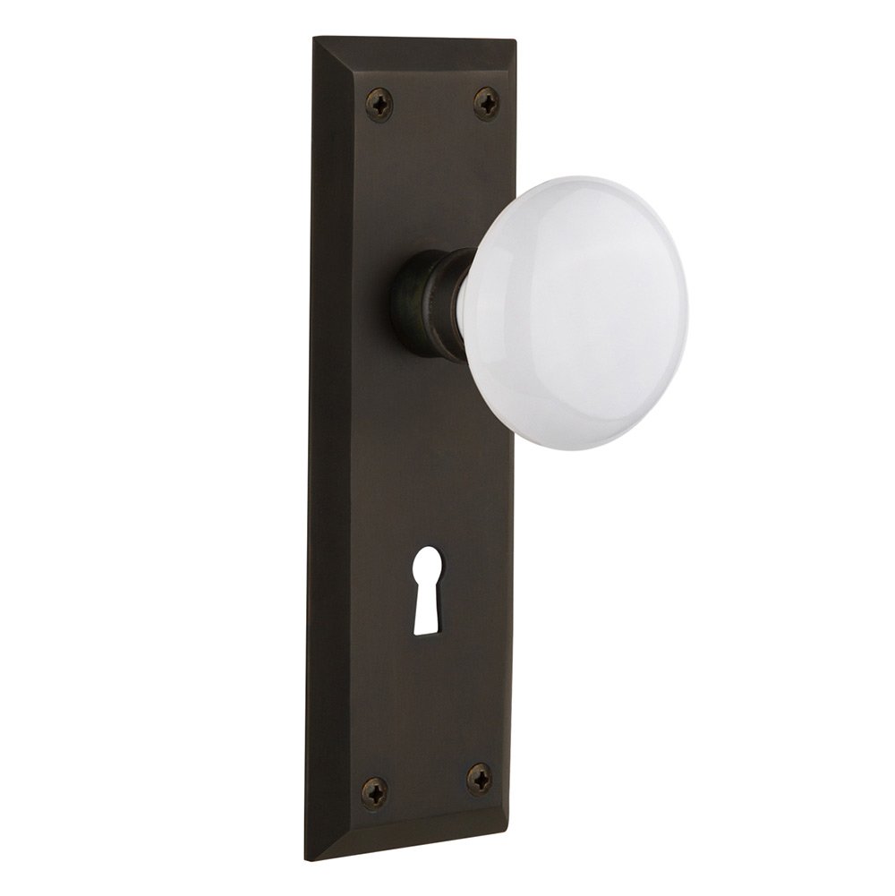 Privacy New York Plate with Keyhole and White Porcelain Door Knob in Oil-Rubbed Bronze