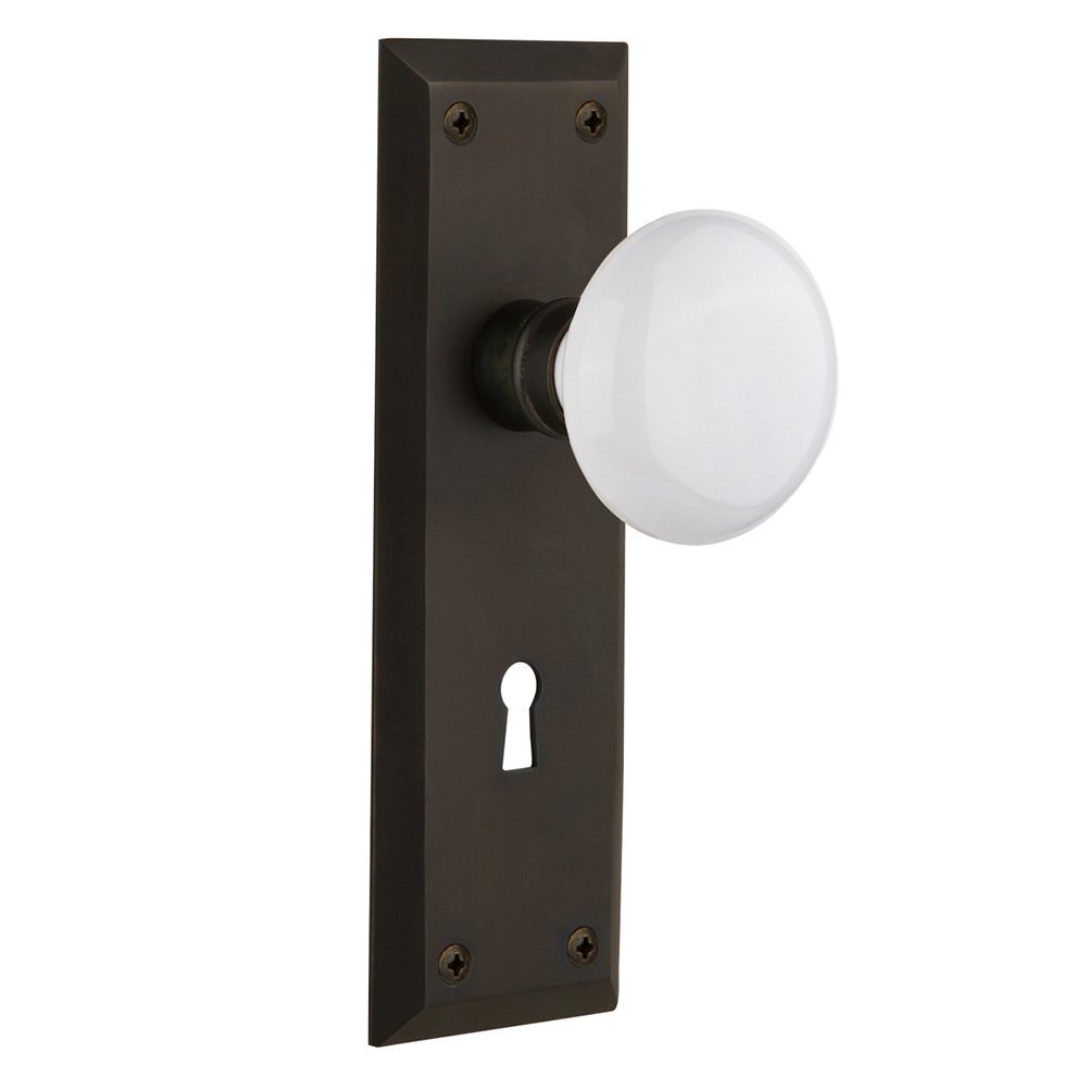Passage New York Plate with Keyhole and White Porcelain Door Knob in Oil-Rubbed Bronze