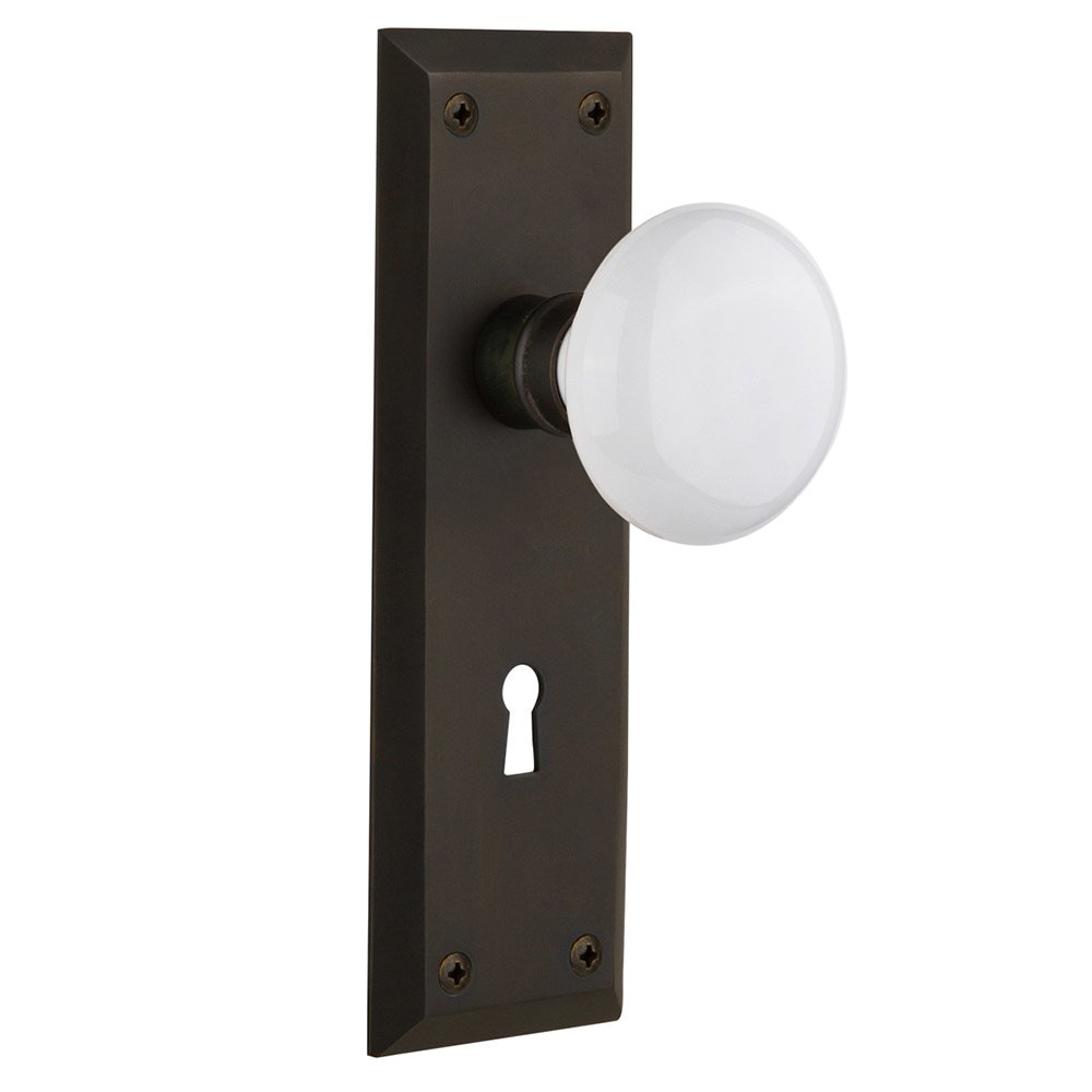 Double Dummy New York Plate with Keyhole and White Porcelain Door Knob in Oil-Rubbed Bronze