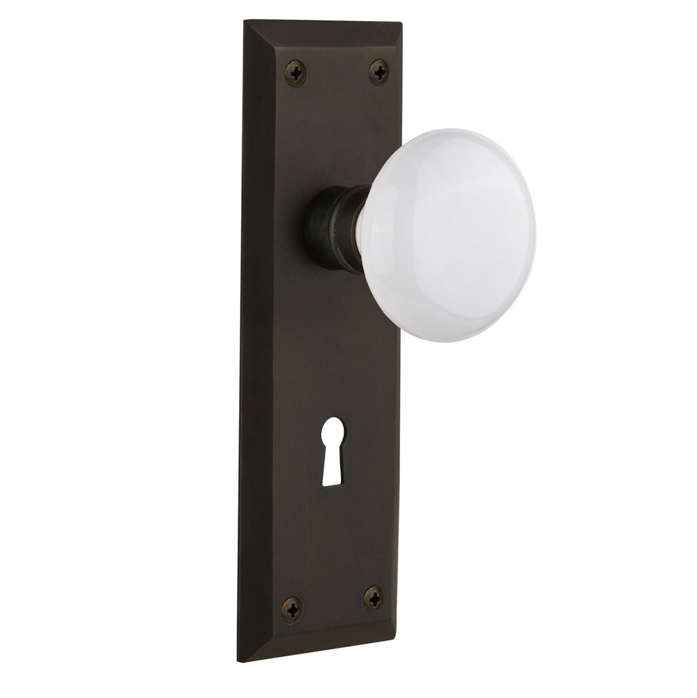Single Dummy New York Plate with Keyhole and White Porcelain Door Knob in Oil-Rubbed Bronze