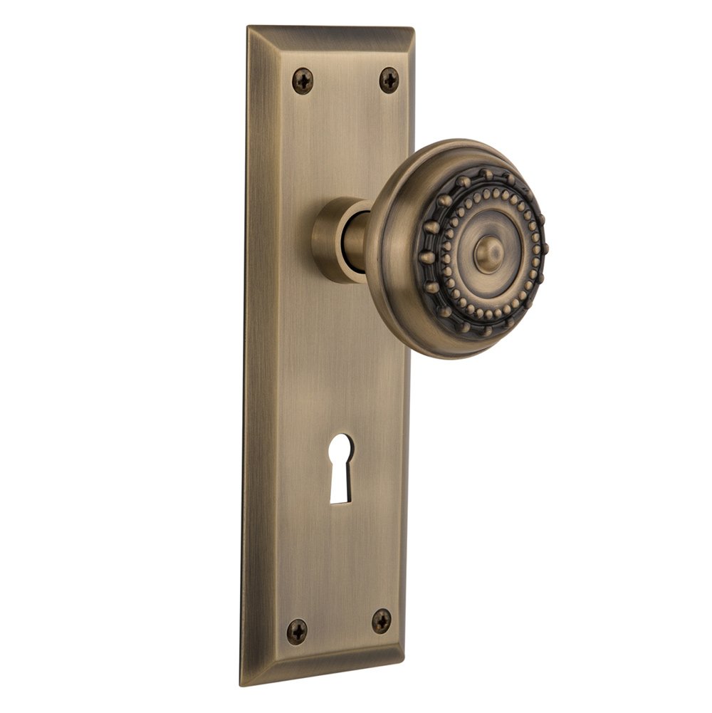 Passage New York Plate with Keyhole and Meadows Door Knob in Antique Brass