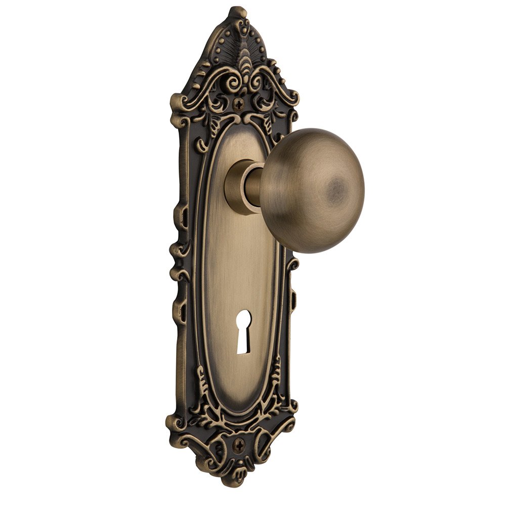 Double Dummy Victorian Plate with Keyhole and New York Door Knob in Antique Brass