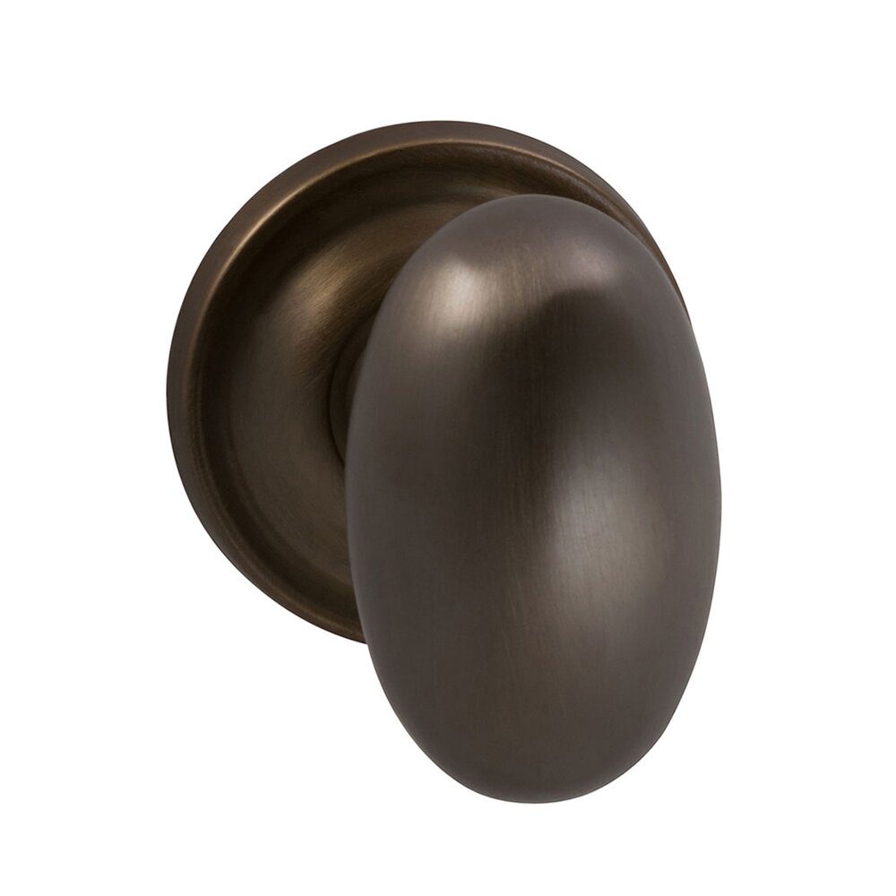 Single Dummy Traditions Classic Egg Door Knob with Medium Radial Rosette in Antique Bronze Unlacquered